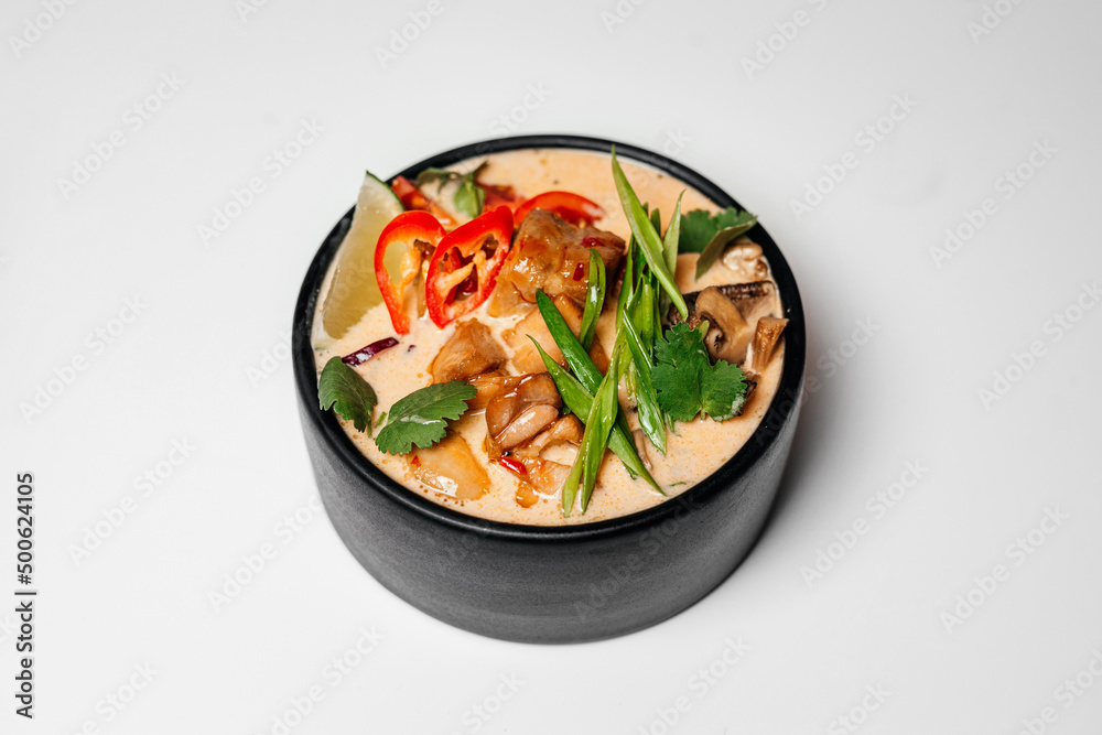 Ramen, noodle and egg soup, Asian food, Ramen in a black round plate, Ramen with chicken and mussels Ramen, noodle and egg soup, Asian food, Ramen in a black round plate, Ramen with chicken and mussels