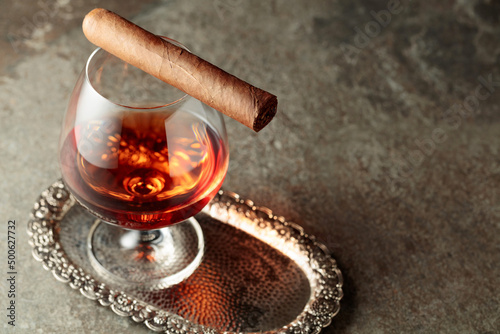 Fototapeta Naklejka Na Ścianę i Meble -  Snifter of brandy and cigar.