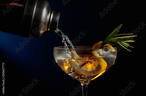 Gin tonic with rosemary and lemon.