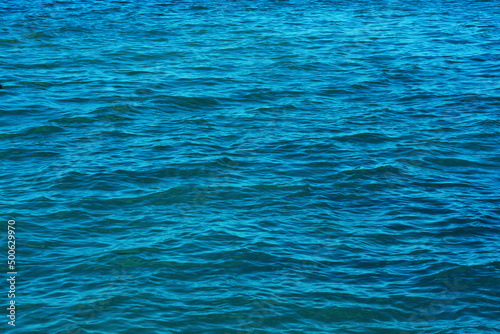 .small waves on the surface of the blue water