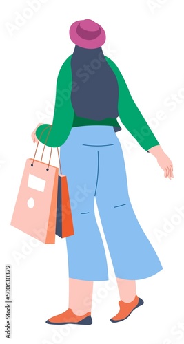 Woman with bags returning from shopping malls