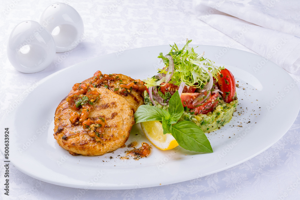 fish cutlets with pike perch and salmon on a white plate fish cutlets with pike perch and salmon on a white plate