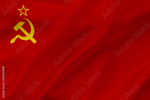 USSR flag on waving silk background. Fabric texture design. Historical flag of Soviet Union.
