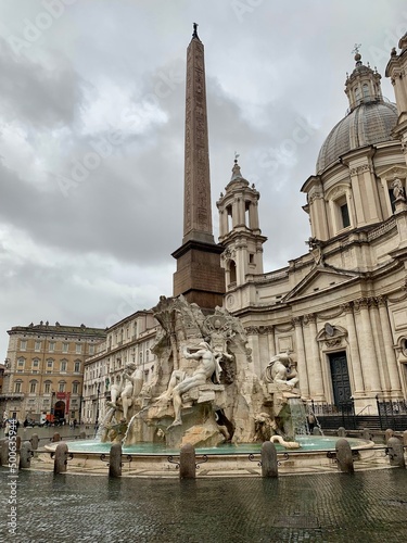 Photos of Piazza Navona in Rome and Bernini's fountain on a rainy day