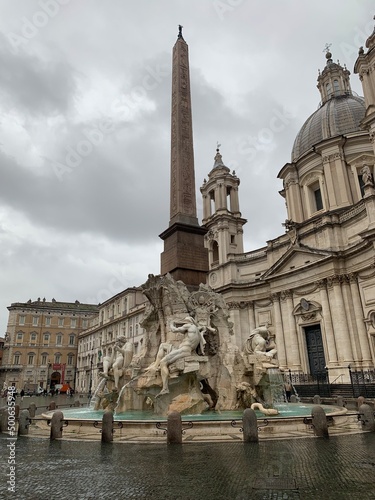 Photos of Piazza Navona in Rome and Bernini's fountain on a rainy day