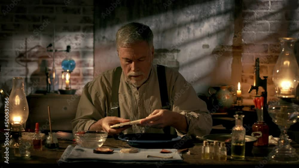 A scene from the early 19th century of an archeologist working with broken pieces of Egyptian pottery. A scene from the early 19th century of an archeologist working with broken pieces of Egyptian pottery.