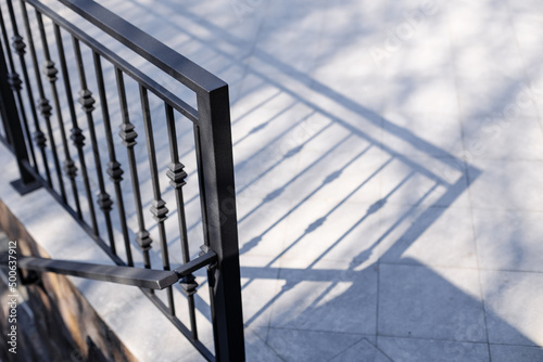 Modern metal railings and handrails in the loft style. The metal is treated with a primer and anti-corrosion paint. Interior design in industrial style.