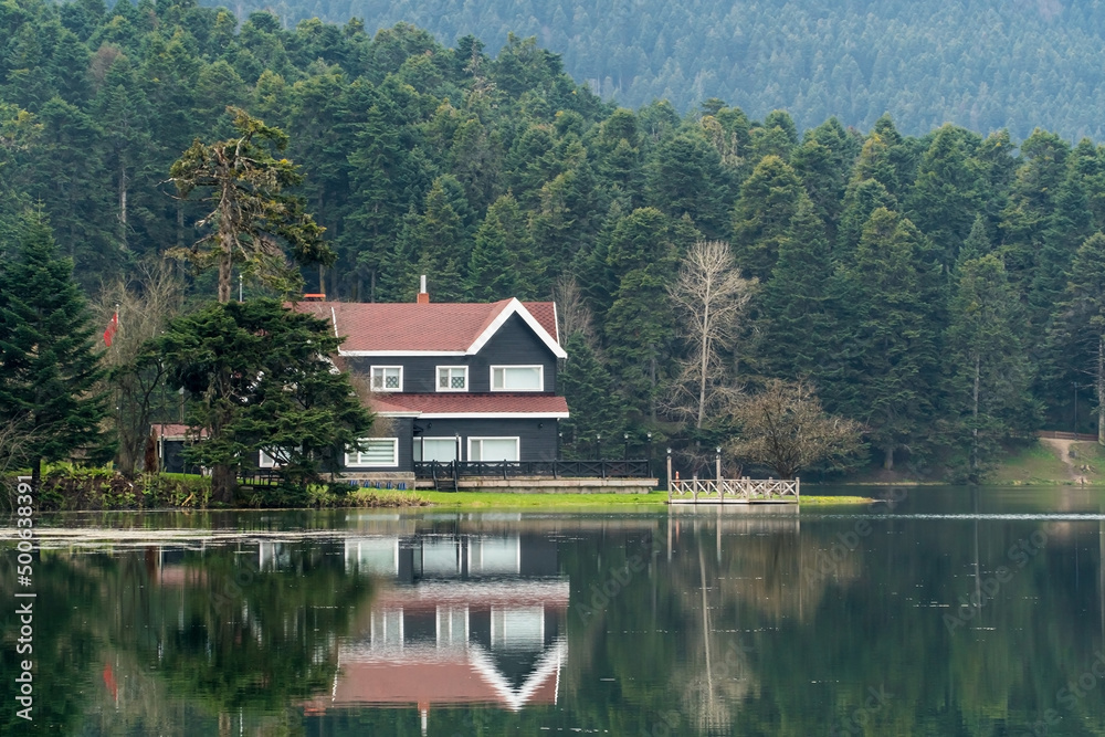 Bolu Golcuk Tabiat Parki. Bolu National Park. Landmarks or touristic places of Turkey. Wooden green house by the lake. 