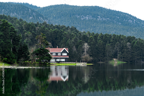 Bolu Golcuk Tabiat Parki. Bolu National Park. Landmarks or touristic places of Turkey. Wooden green house by the lake. 