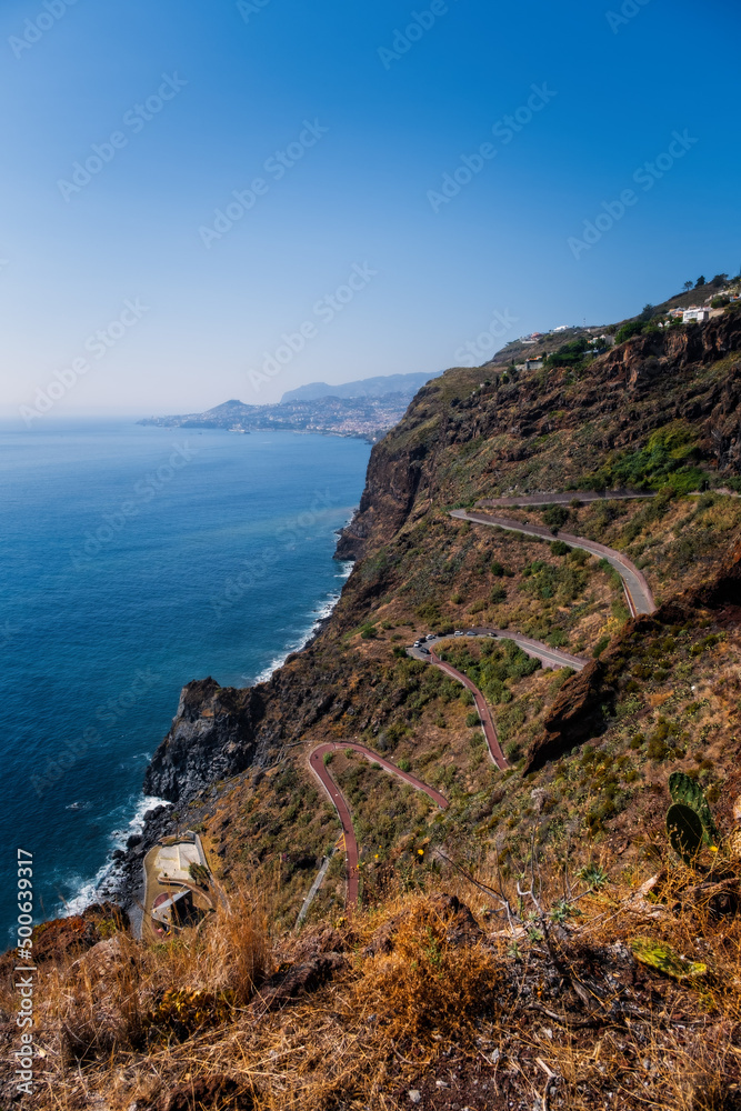 View of a road with many curves in Canico, Madeira on the coastline. October 2021