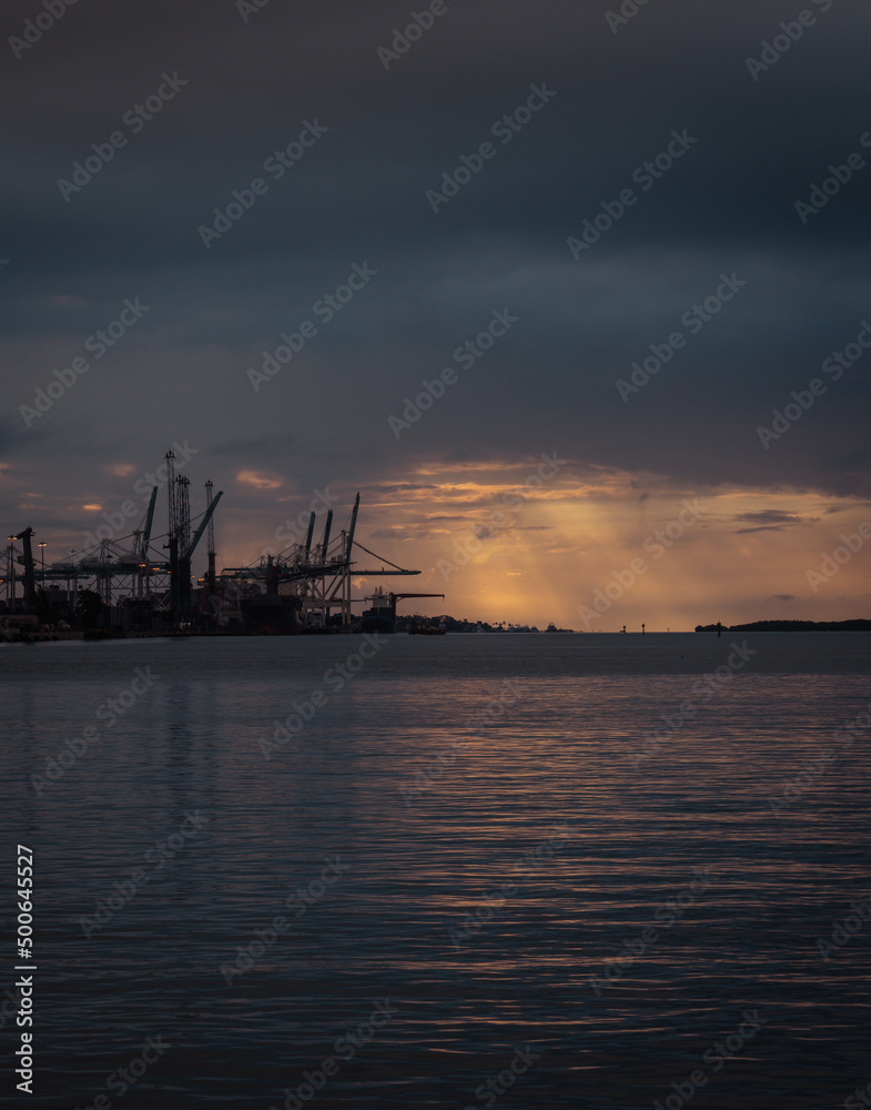 sunset in the port sea reflections sun miami 