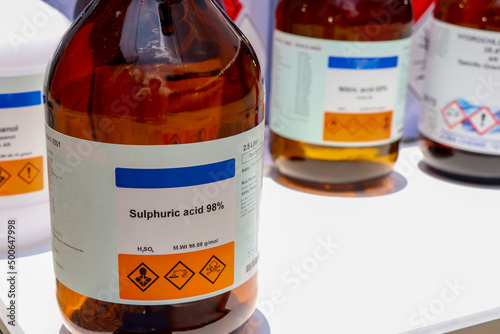sulfuric acid in bottle, chemical in the laboratory photo