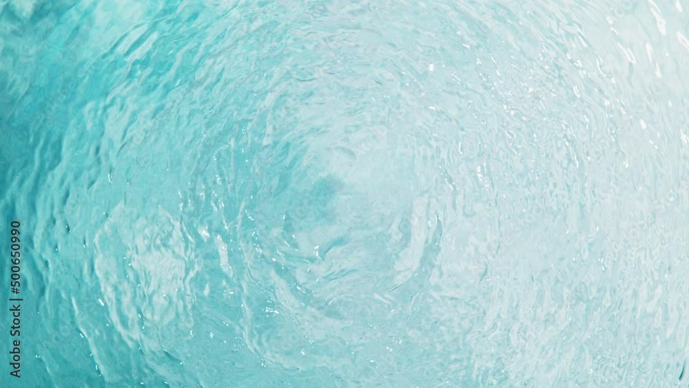 Super Slow Motion Shot of Clear Water Surface Waving Over White Sand Beach at 1000fps.