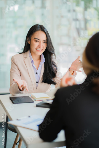 Cuadro en lienzo A meeting of two young Asian businesswomen to collaborate and work as a team for success in business and finance