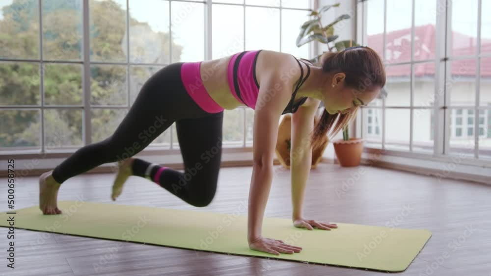 Young fitness woman in sportswear exercising at home, Healthy and Lifestyles.
