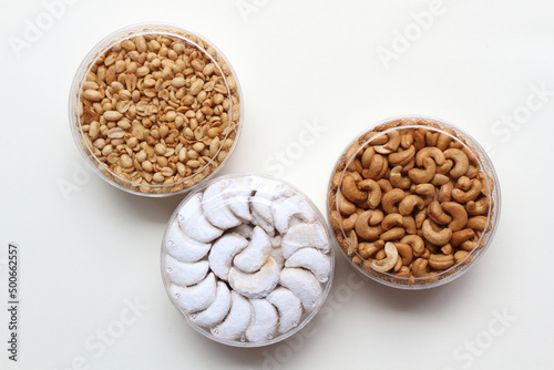 Three jars of Kacang Mete Goreng (Fried Cashew Nuts), Kacang Goreng (Fried Peanuts), and Kue Putri Salju or Vanillekipferl (Austrian crescent shaped vanilla biscuits)