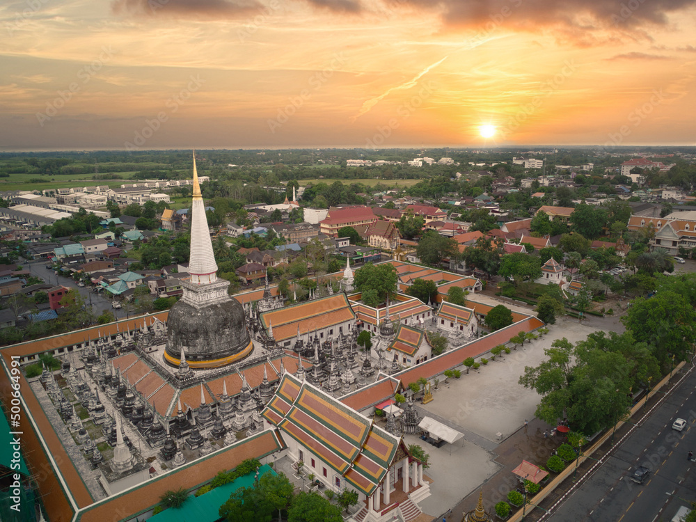 Fototapeta premium Wat Phra Mahathat Woramahawihan pagoda in the evening beautiful sky Nakhon Si Thammarat, Thailand, high angle