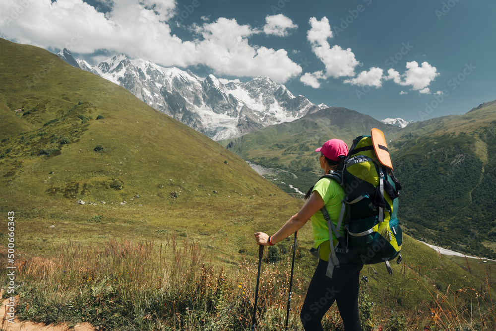 Young active girls hiking in Greater Caucasus mountains, Svaneti region, Mestia district, Svaneti, Georgia