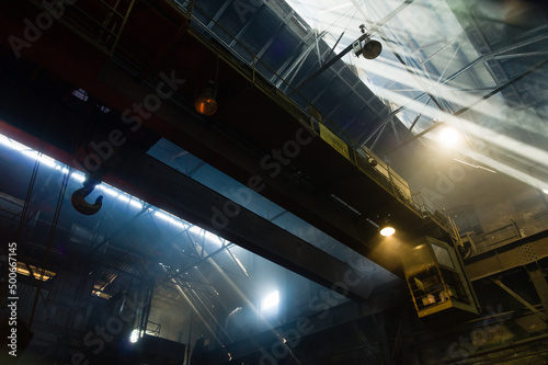 Large industrial crane operating in a foundry
