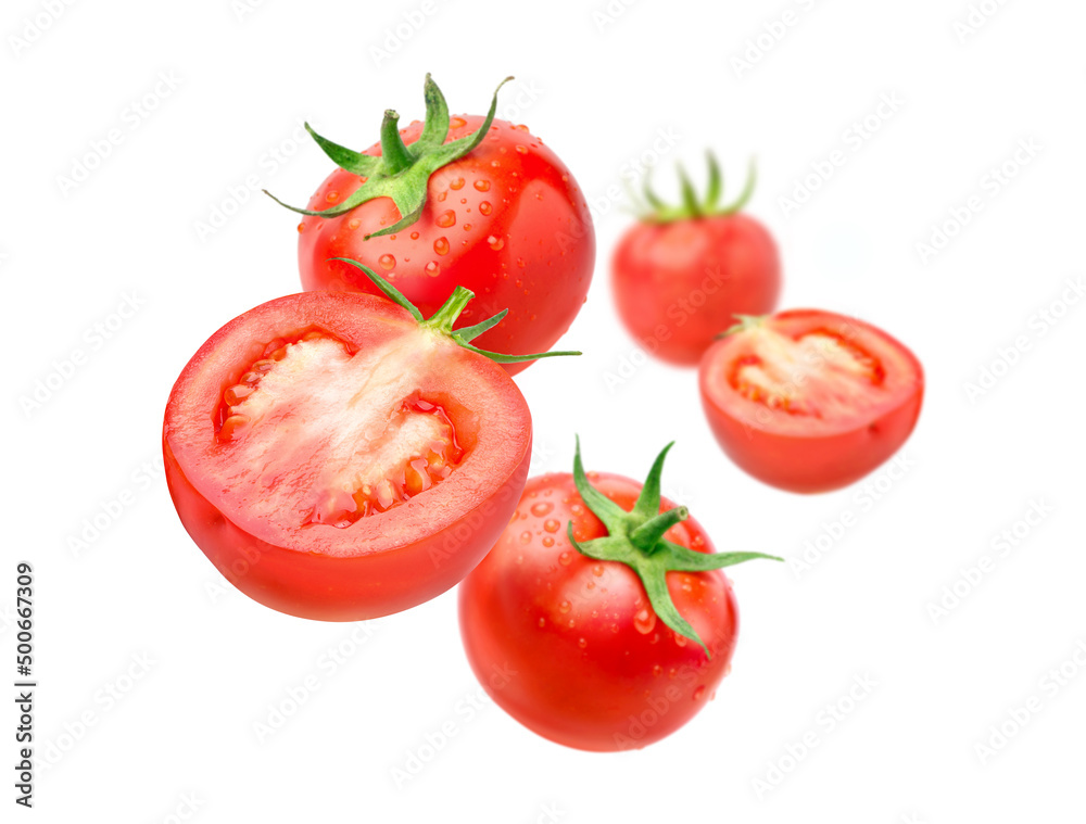 Fresh tomatoes levitate isolated on a white background. Fresh tomatoes levitate isolated on a white background.