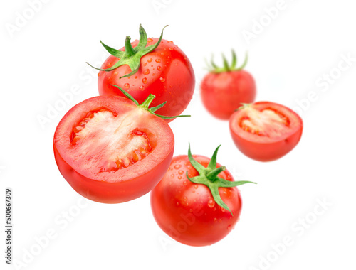 Fresh tomatoes levitate isolated on a white background.