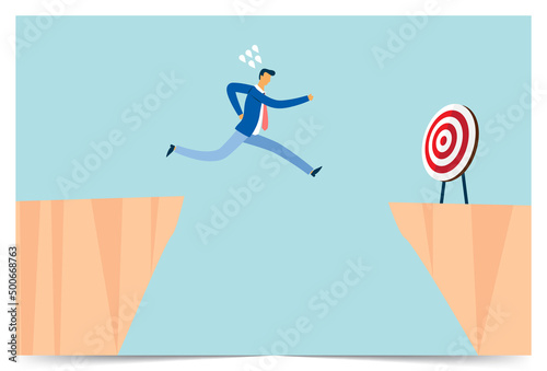 Businessman jumps at his goal at a risk