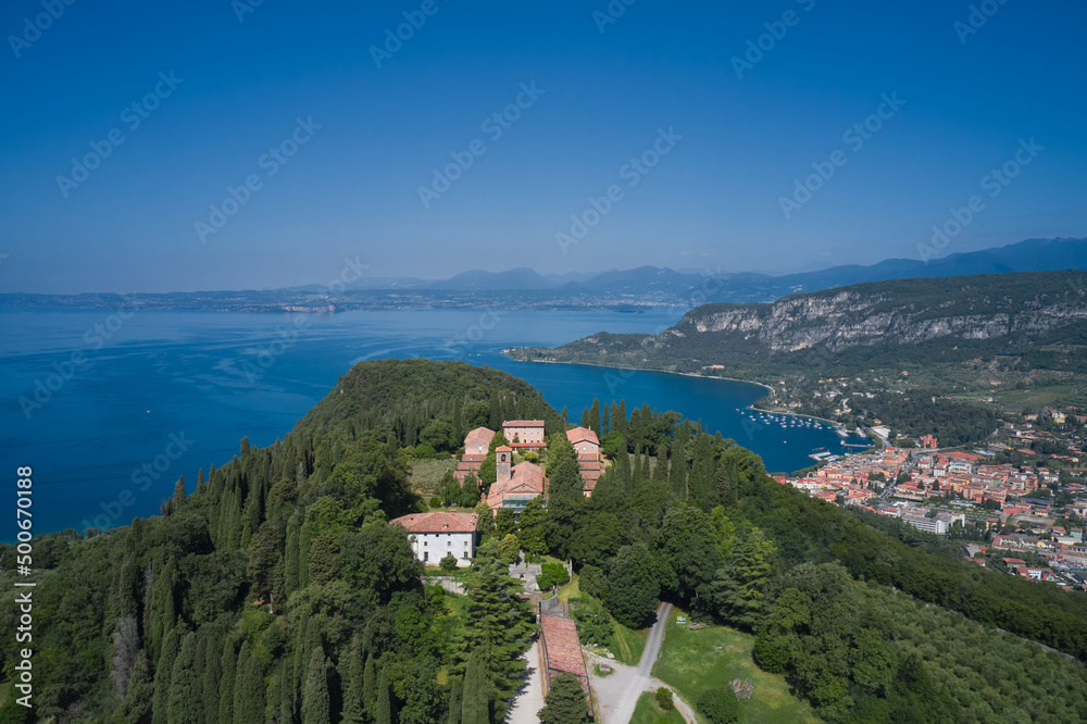 Monastery on the Eremo di San Giorgio hill,.Lake Garda, Italy. Aerial view of Eremo di San Giorgio, Bardolino. Aerial panorama Monastery on the hill. Home of Italian monks, lake garda.