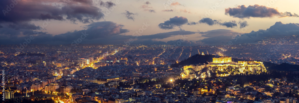 Athens, Greece. Acropolis and Parthenon illuminated at night, aerial panorama view
