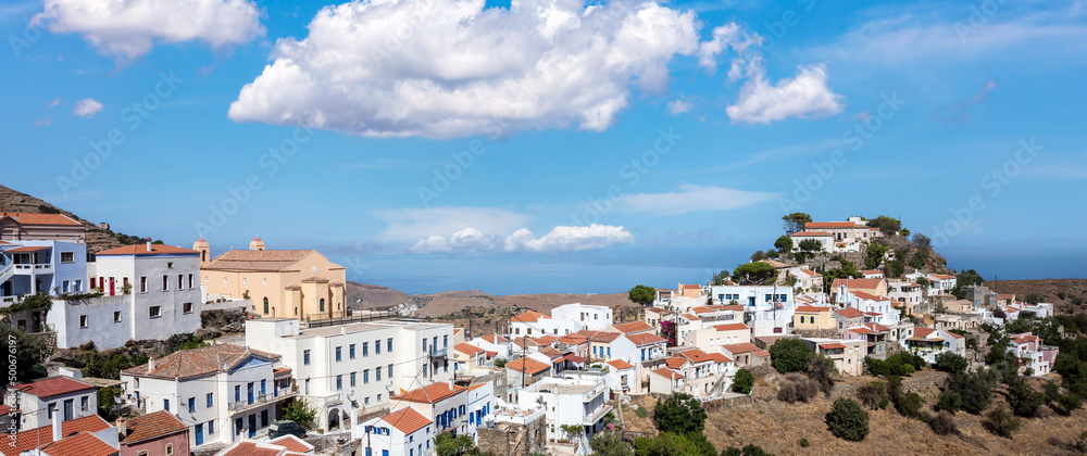 Kea island, Greece. Ioulis town panorama aerial view. Tzia Chora cityscape, blue cloudy sky