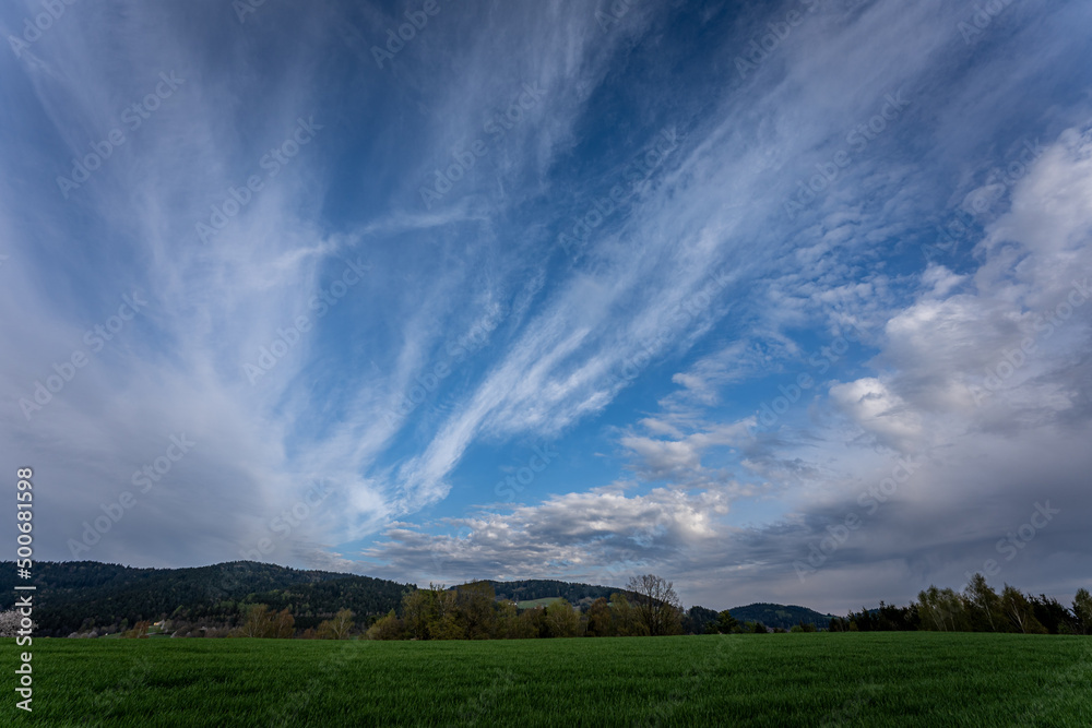 Blue sky and beautiful cloud with meadow and landscape. Simple landscape background for summer posters. Relaxing feeling like in heaven. Blue sky and beautiful cloud with meadow and landscape. Simple landscape background for summer posters. Relaxing feeling like in heaven.