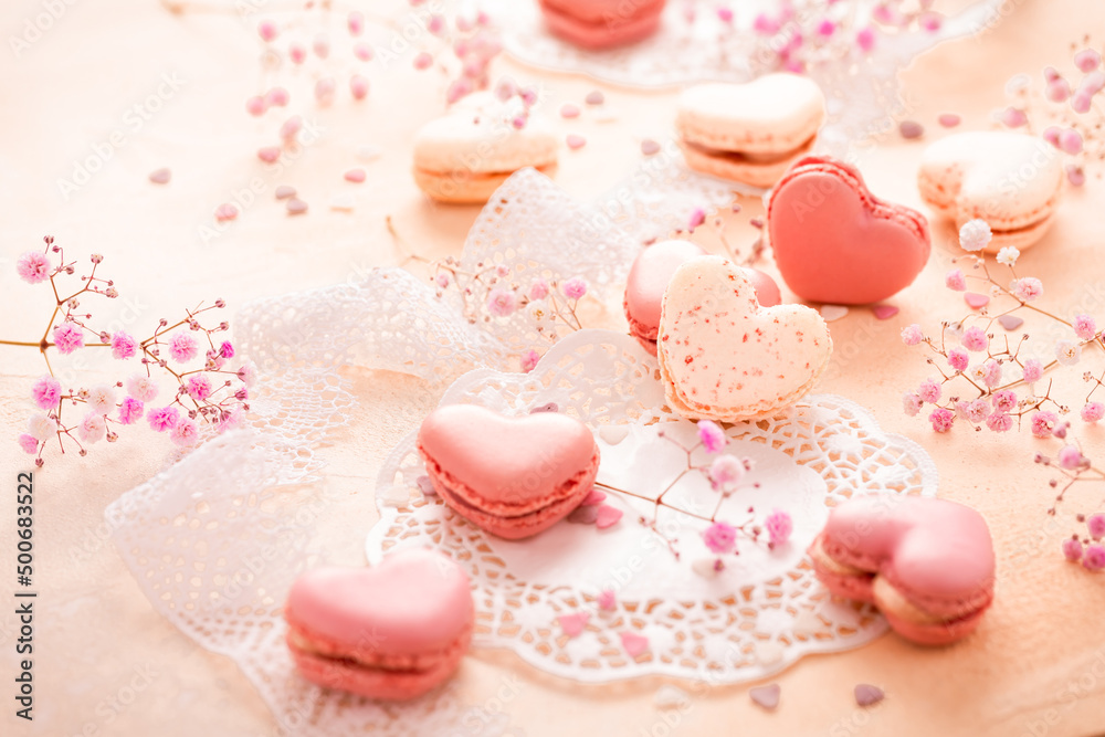Happy Mothers Day - sweet macarons in heart shape with flowers in pink tone Happy Mothers Day - sweet macarons in heart shape with flowers in pink tone