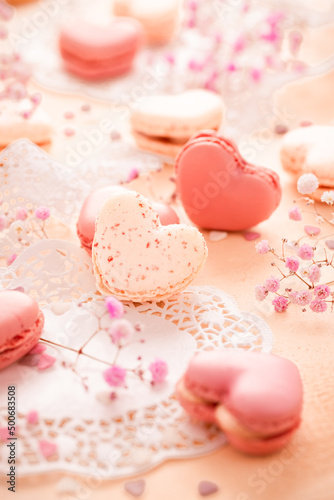 Happy Mothers Day - sweet macarons in heart shape with flowers in pink tone