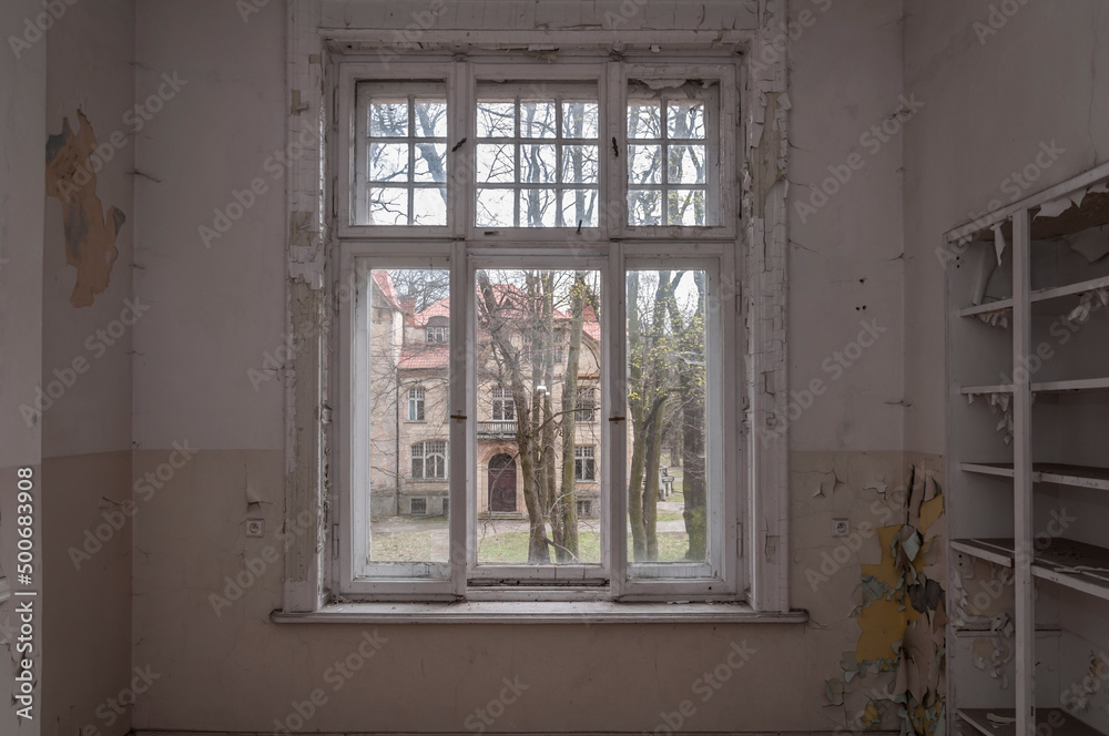 Fototapeta premium Urban exploration in an old abandoned hospital in a historic mansion in Poland - Urbex in Turczynek