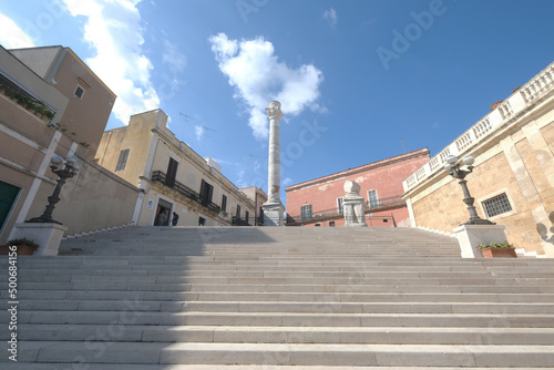 Virgiliana staircase on which the two Roman columns that indicate the end of the Appian, Brindisi, Apulia, Italy photo