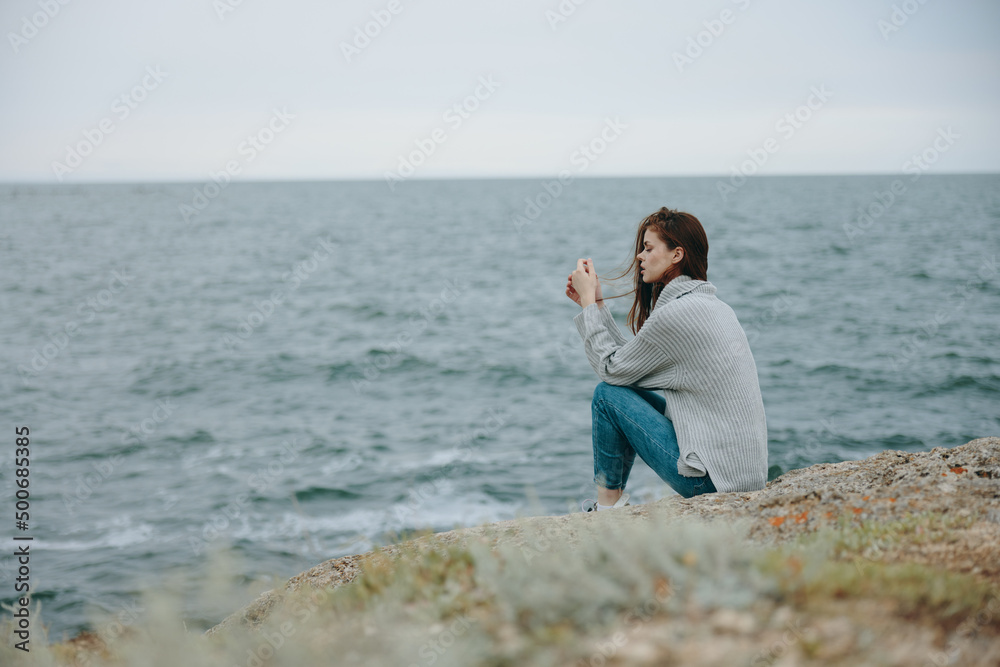 pretty woman sweaters cloudy sea admiring nature Relaxation concept