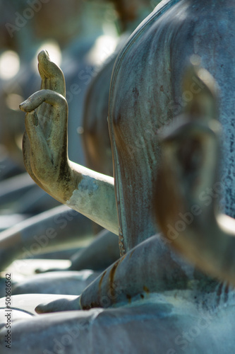 Closeup of hand mudra on Buddha statue