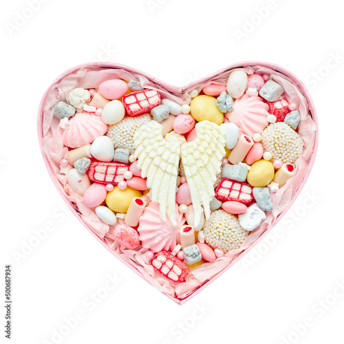Pink heart-shaped box filled with sweets on a white background