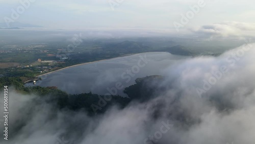 Wallpaper Mural Aerial move over fog cloud flow at the forest cover Mengkuang dam Torontodigital.ca