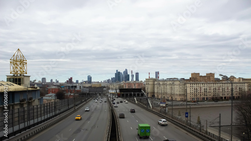 Beautiful old buildings. Overcast weather. Business center Moscow city in the distance. Highway with cars