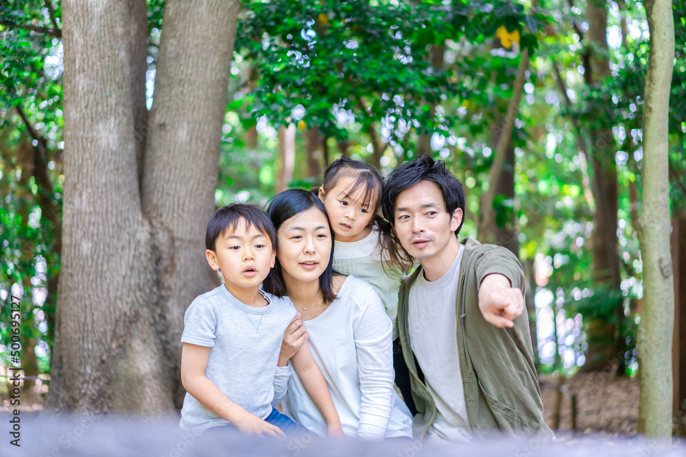Family observing nature in the forest Family observing nature in the forest