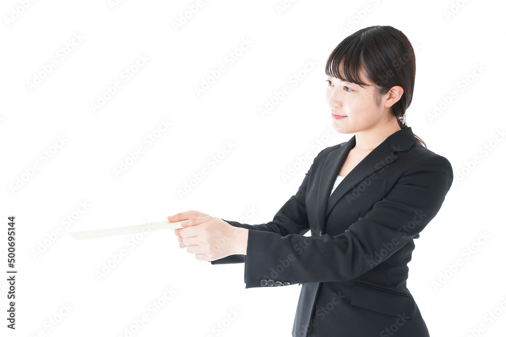 Businesswoman wearing a suit submitting documents Businesswoman wearing a suit submitting documents
