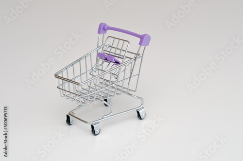 toy metal grocery basket isolated on white background