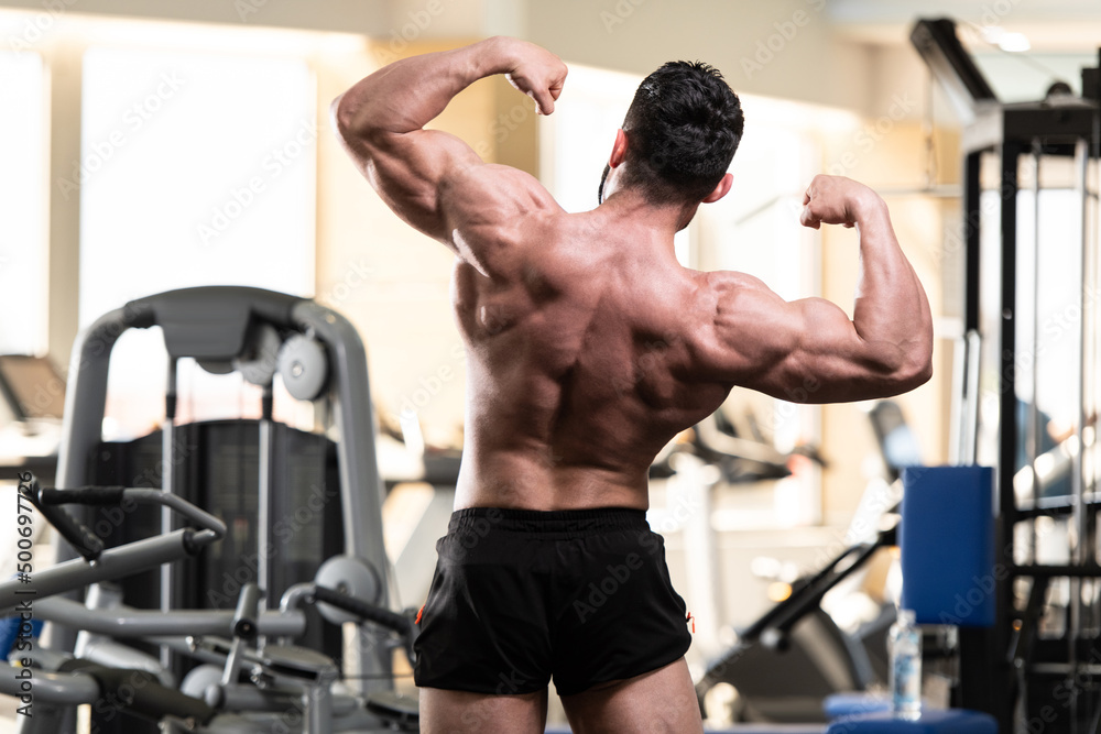 Bodybuilder Performing Back Double Biceps Pose Stock Photo | Adobe Stock