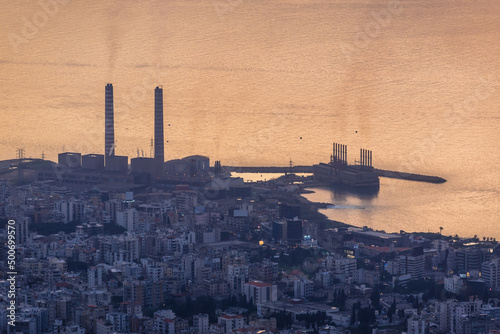 Shore of Mediterranean Sea coast in Lebanon, view with Zouk Power Station in Zouk Mikael town photo