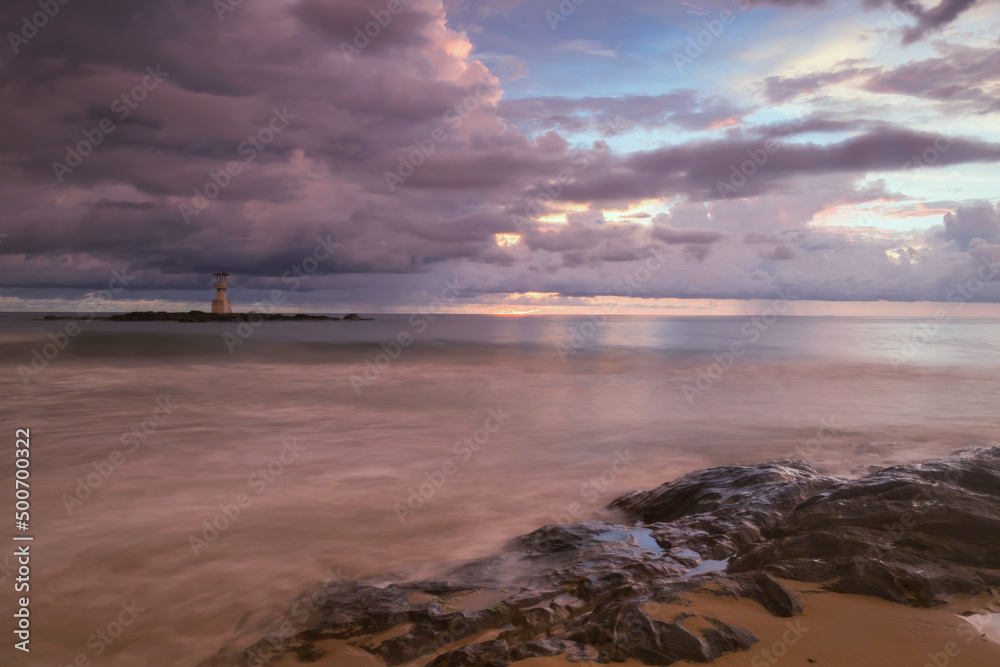 Seascape with lighthouse beacon tower and cloudy sky of Khao Lak