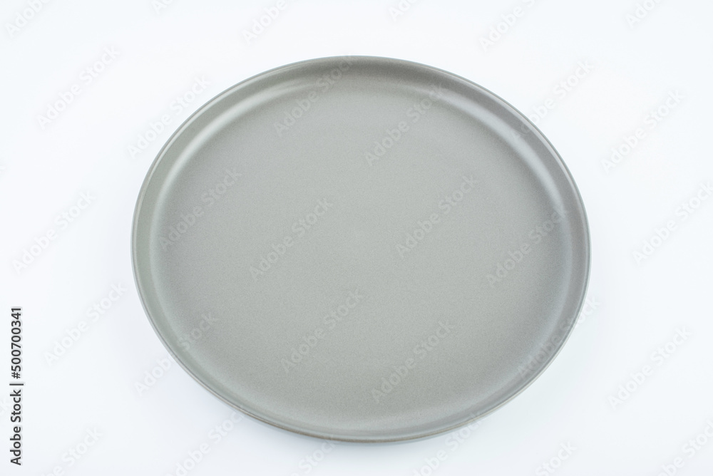 A ceramic western steak plate on a white background A ceramic western steak plate on a white background