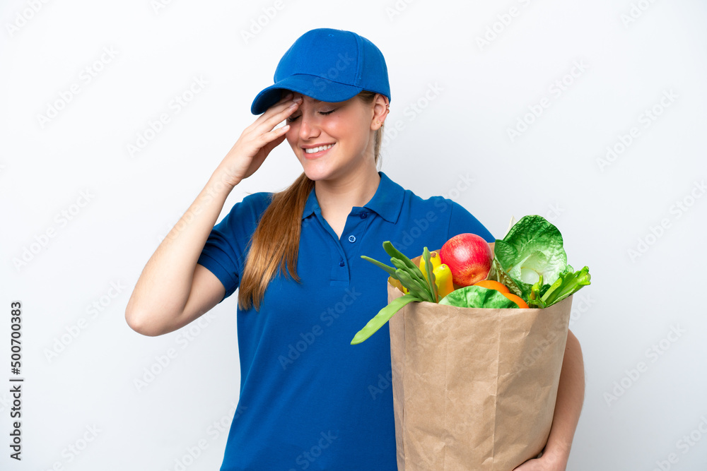 Young delivery woman taking a bag of takeaway food isolated on white background laughing Young delivery woman taking a bag of takeaway food isolated on white background laughing