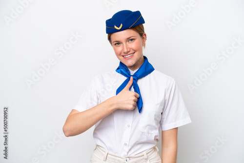 Airplane stewardess woman isolated on white background giving a thumbs up gesture © luismolinero