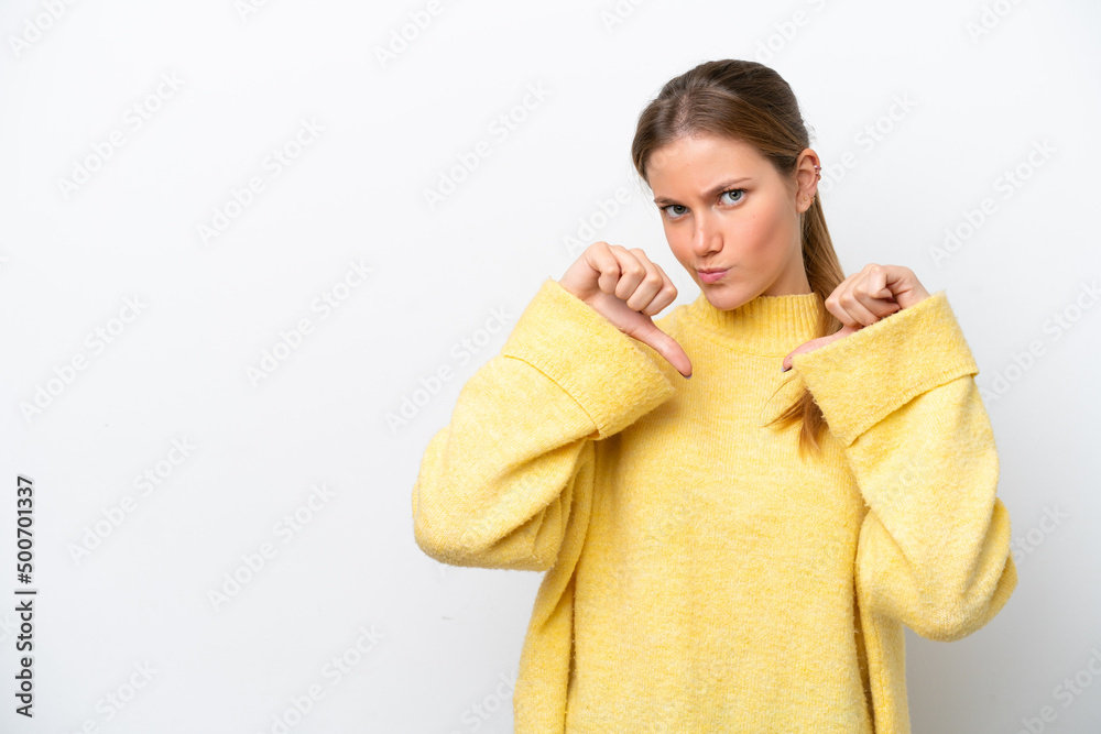 Young caucasian woman isolated on white background showing thumb down with two hands Young caucasian woman isolated on white background showing thumb down with two hands