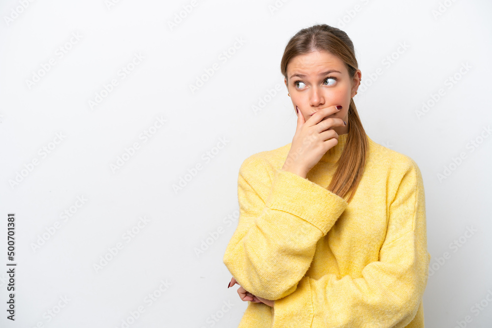 Young caucasian woman isolated on white background having doubts and with confuse face expression Young caucasian woman isolated on white background having doubts and with confuse face expression